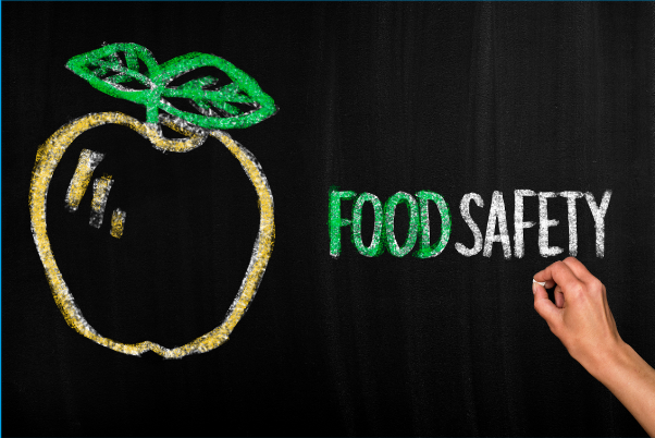 Blackboard with food safety written in text and an image of an apple