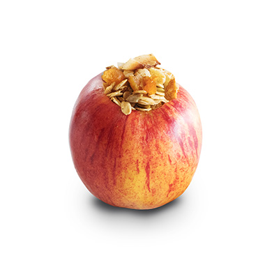 A red apple stuffed with granola