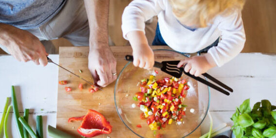 child helping dad prepare for dinner